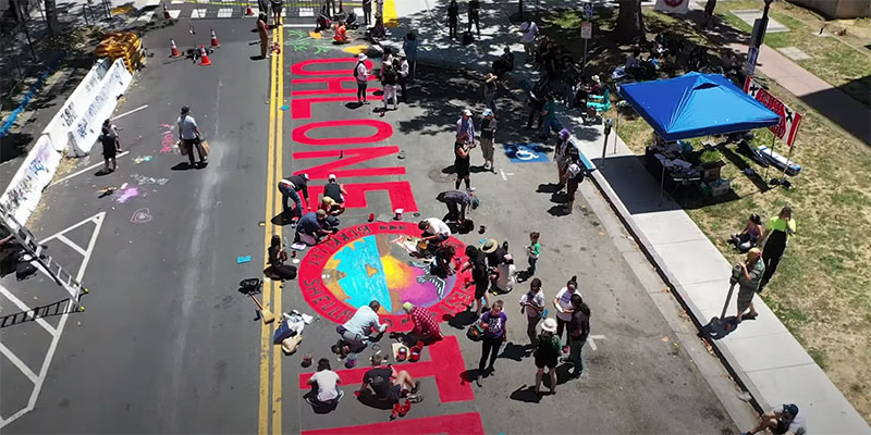 aerial photo of a mural painted on a street