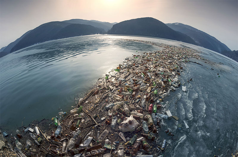 photo of plastic trash on a beach