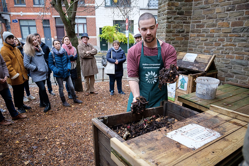 photo of someone demonstrating how to make compost