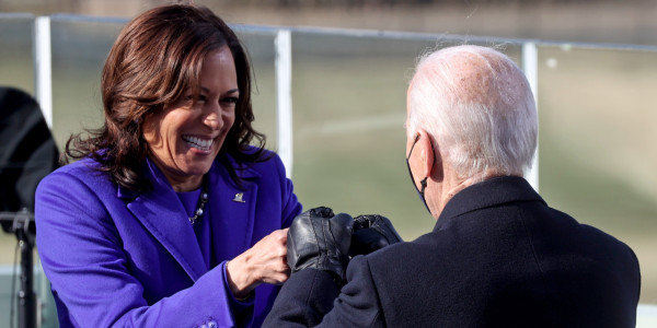 WASHINGTON, DC - JANUARY 20: Vice President Kamala Harris fist bumps President-elect Joe Biden after she was sworn in at their inauguration on the West Front of the U.S. Capitol on January 20, 2021 in Washington, DC. During today's inauguration ceremony Biden becomes the 46th President of the United States. (Photo by Jonathan Ernst-Pool/Getty Images)