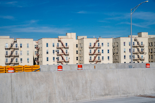 Roadwork is done in front of a low-income housing project in the Bronx borough of New York City