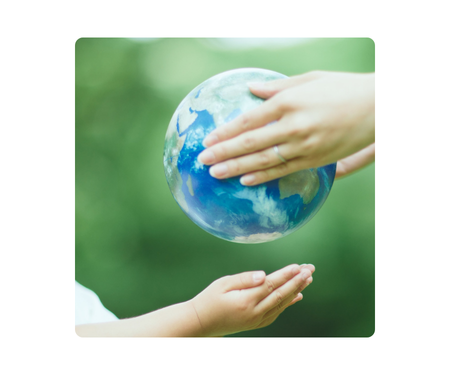 Globe Being Handed from One Person to Another