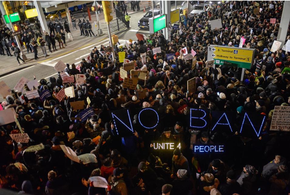 Protesters coming together to voice their disagreement with the Muslim ban.