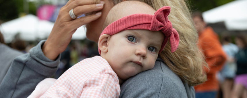 A baby and mother at Run for Gus