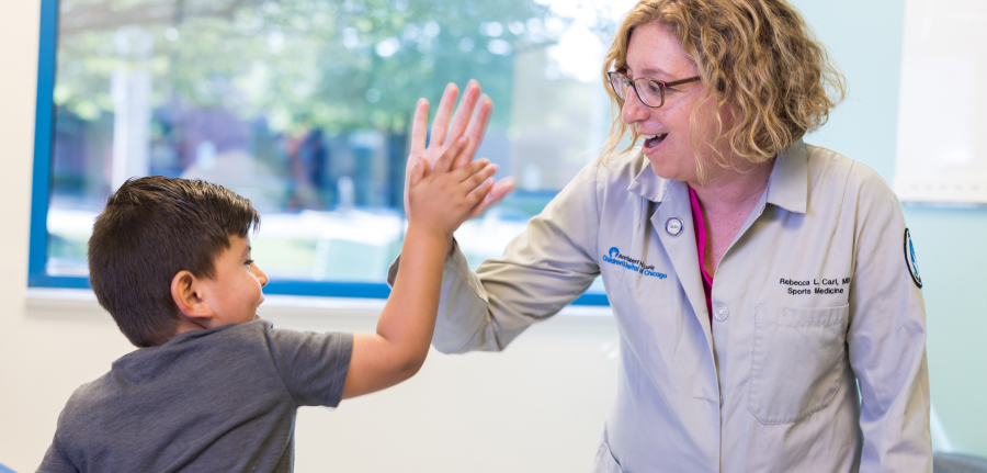 A happy doctor and patient high-five.
