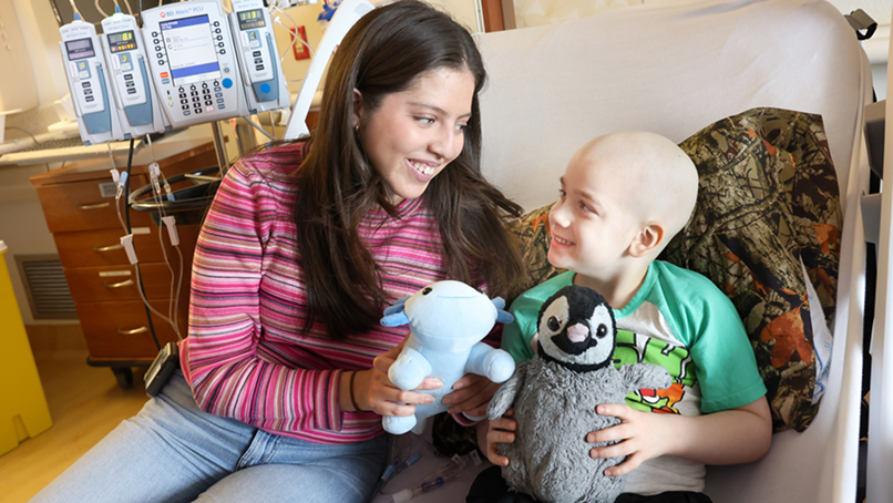 Woman with patient and stuffed animals