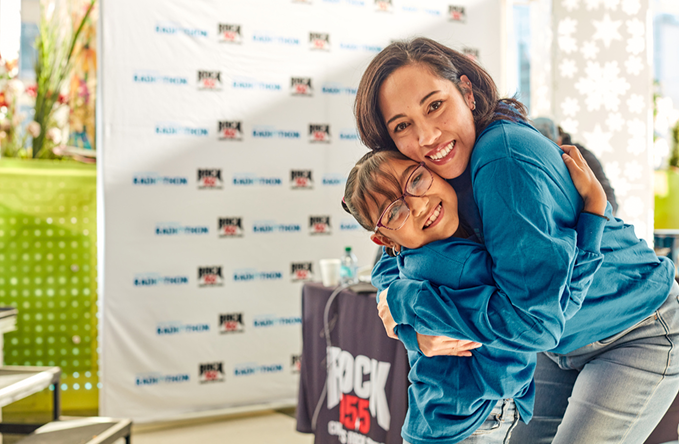 Mother and daughter hugging