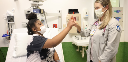 A patient and caretaker mini high-five.