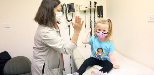 A patient and caretaker high-five.