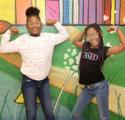 Two girls smiling