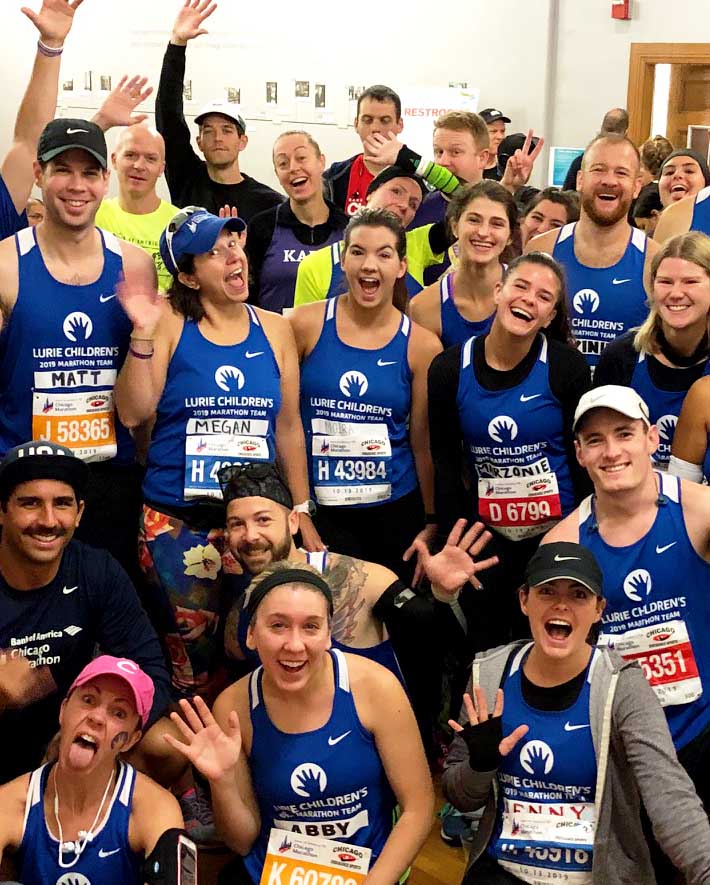 A group of runners waiving.