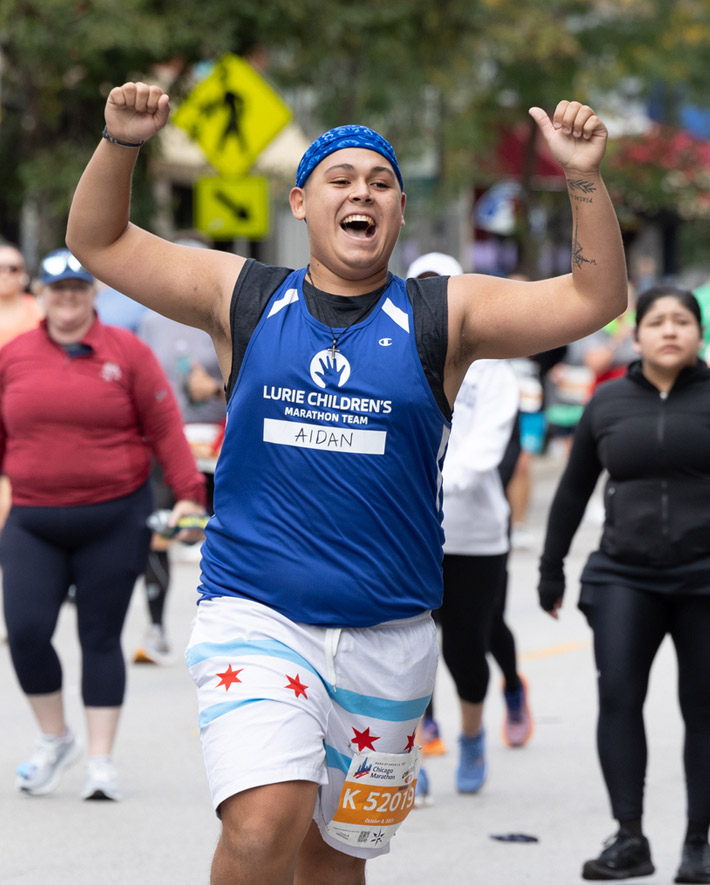 A group of runners waiving.