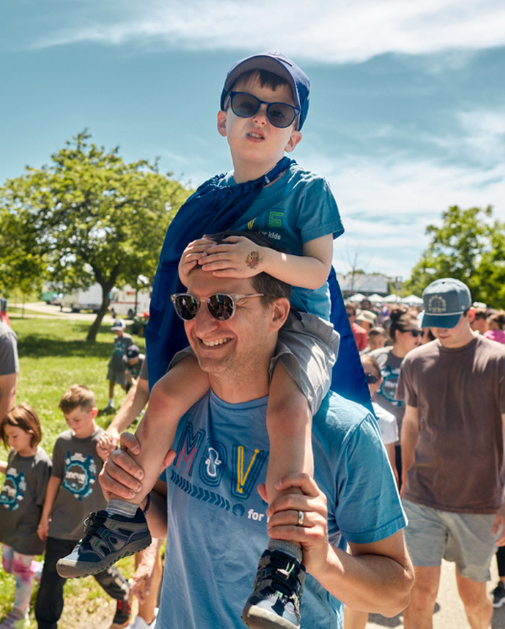 A dad and son walking and enjoying the event.