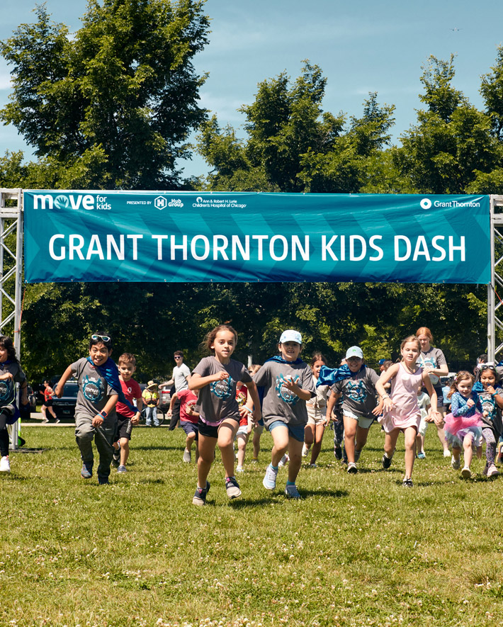 A photo of a group of children participants running.