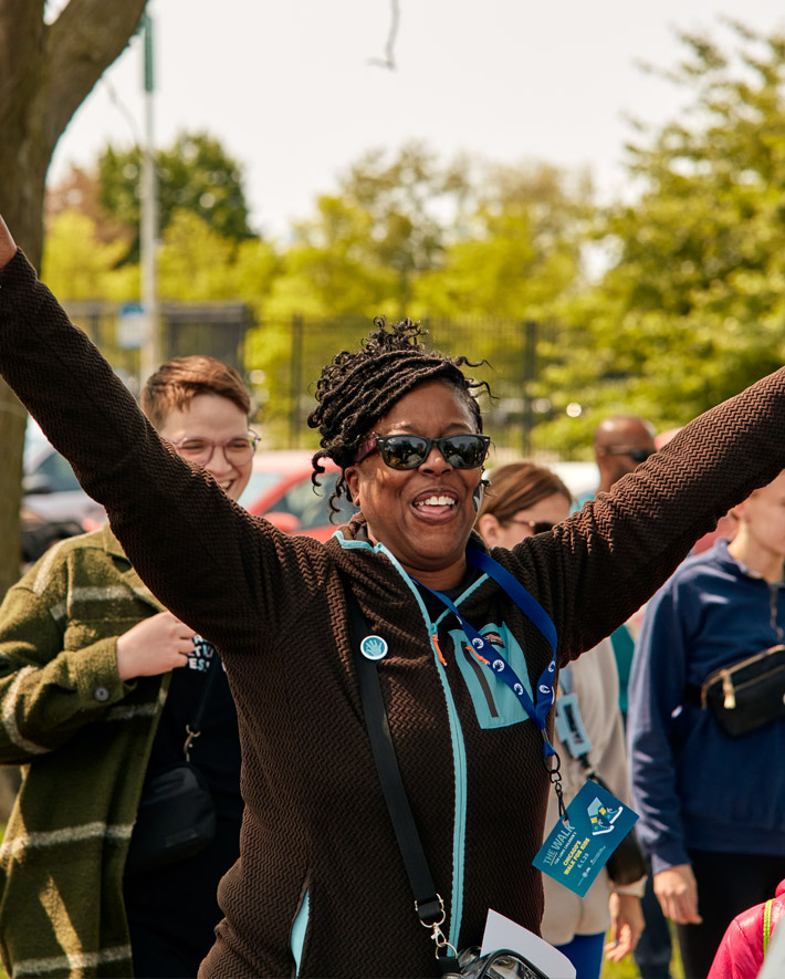 A photo of a lady cheering at the event.