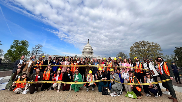 Group of advocates with caution tape in Washington DC