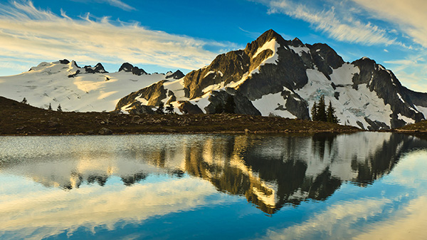 Mountain and reflection in a lake, North Cascades, WA