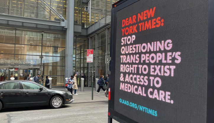 Digital sign on the sidewalk. Dear New York Times: stop questioning trans people's right to exist and access to medical care. glaad.org/NYTIMES