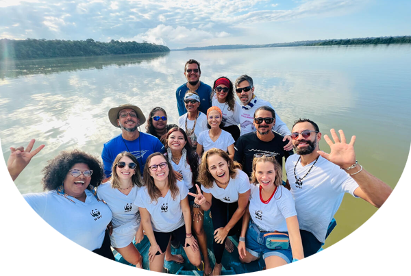 People gathered on a boat for the expedition to count the Amazon river dolphins in the Tapajós River, in partnership with the Mamirauá Institute and Reckitt