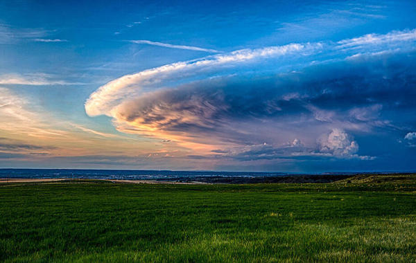 Big cloud above grass plains