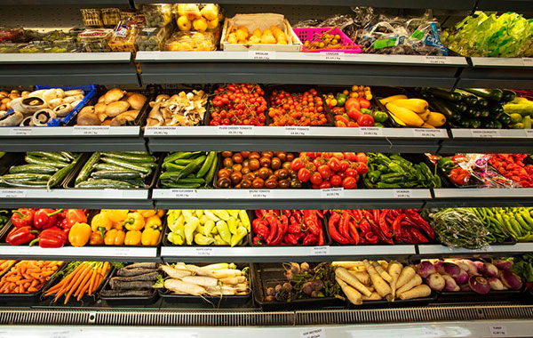 Vibrant produce lines the shelves at a store