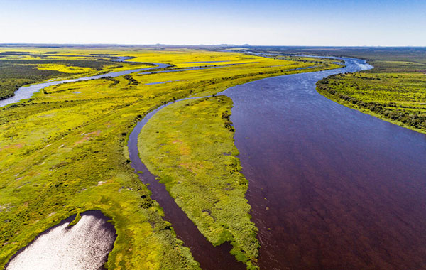 Bolivian waterways with grassy patches built in and around the water passageways