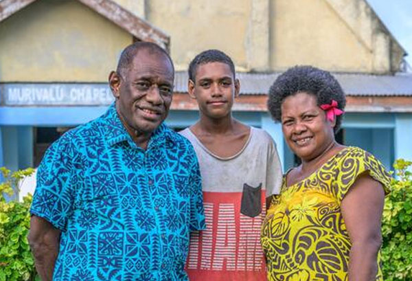 Ratu Manasa Naikasowalu, his wife Tulia Naikasowalu, their son Junior Roman - a Fiji family poses together