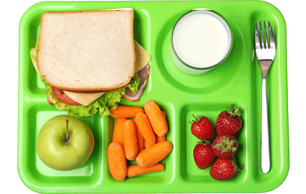 A sandwich, green apple, carrots, strawberries, fork, and glass of milk on a green tray