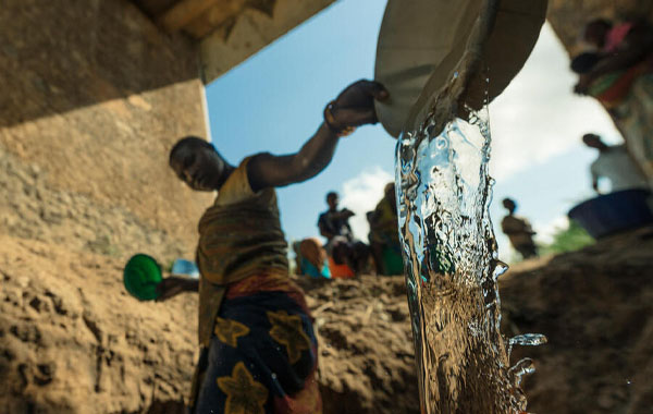 Person pouring water out of a deep plate/bowl