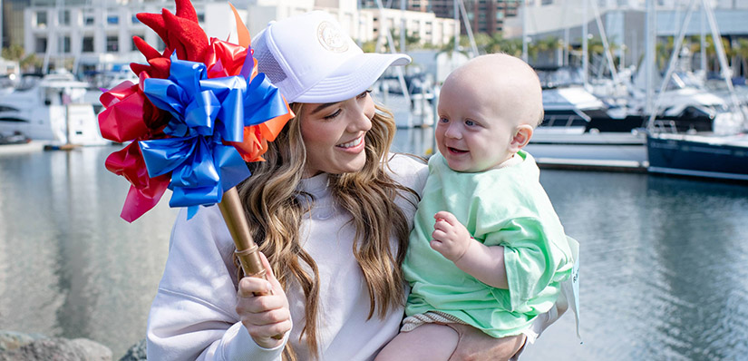 Knox being held by his mother