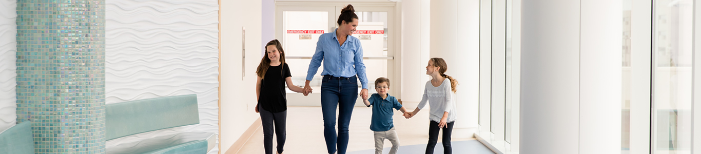 mom and kids holding hands