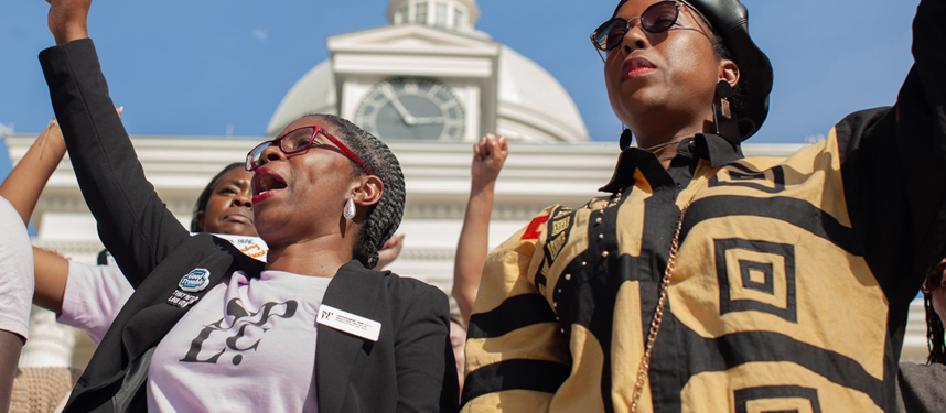 A photo of a group of Black women protesting outdoors.
