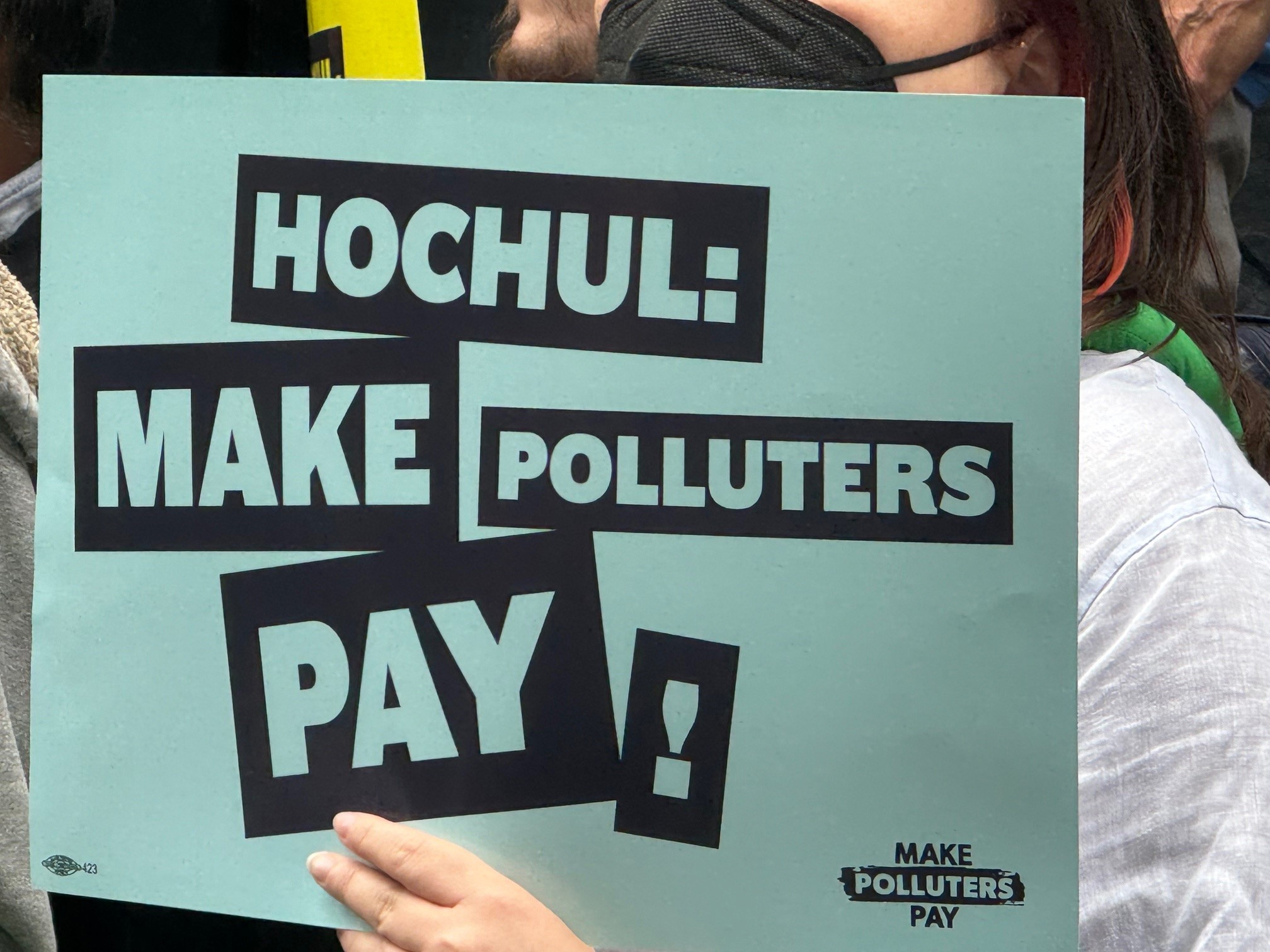 Sign reading HOCHUL: MAKE POLLUTERS PAY!