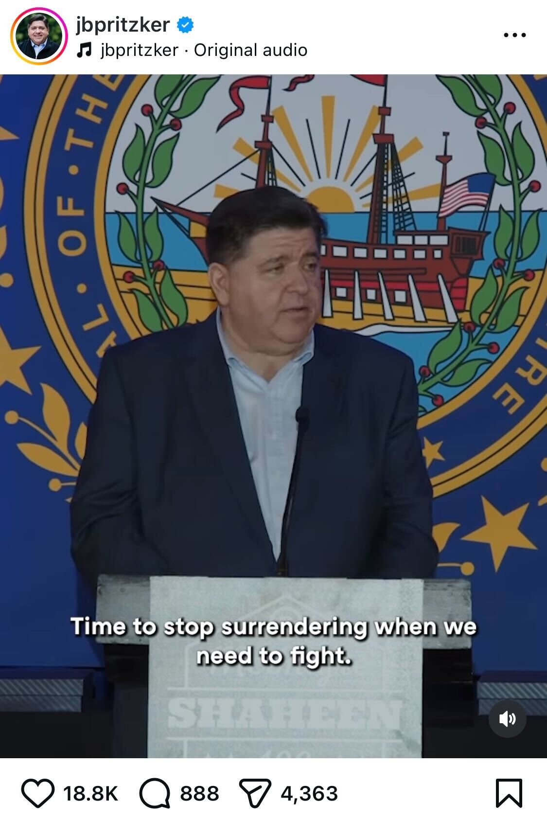 JB Pritzker speaking at podium
