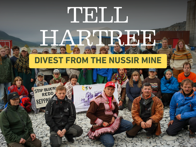 A large group of Indigenous and environmental activists gathers at a mining protest site, with tents and industrial structures in the background. Overlaid text reads TELL HARTREE and DIVEST FROM THE NUSSIR MINE.