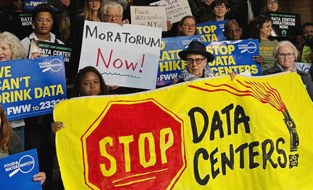 Activists holding a Stop Data Centers banner