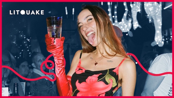A portrait of author Brittany Newell holding a glass of water and sticking her tongue out.