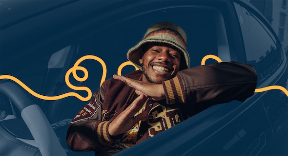 Bay Area rapper LaRussell smiles and throws up the Thizz sign.