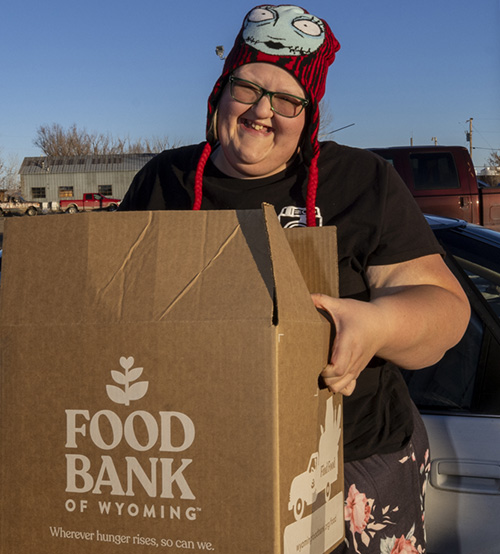Person with box of food.