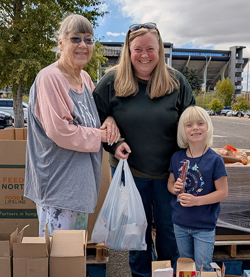 Family with boxes of food.
